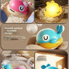 A yellow and pink whale bath toy designed for baby, featuring a light-up feature and water spray.