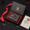 A black leather smart wallet with an RFID blocking feature is displayed in a box, surrounded by red shredded material and a r