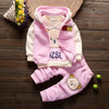 A pink and cream 3-piece cartoon loungewear set for kids, including a fleece hoodie, vest, and pants.