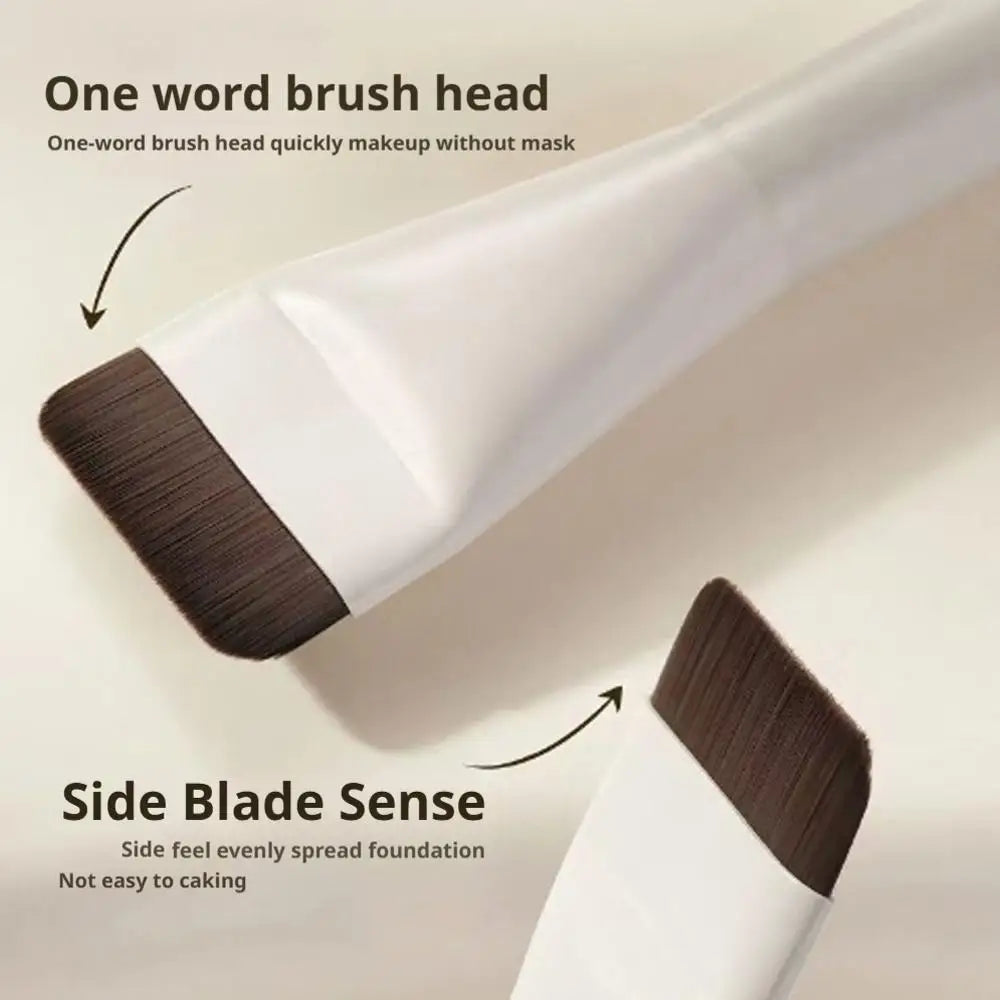 A white flat foundation brush is shown demonstrating a one-word brush head and side blade sense for easy makeup application.