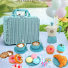 A coffee picnic basket set featuring a wicker basket, tea, pastries, and balloons on a checkered tablecloth.