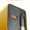 A close-up view of a yellow power adapter with a black port and a retractable cable inside.