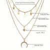 Gold three-layer pendant necklace featuring stars and a crescent moon charm