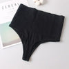 Black high-waist tummy control butt lifter thong shaper underwear laid on a white surface.