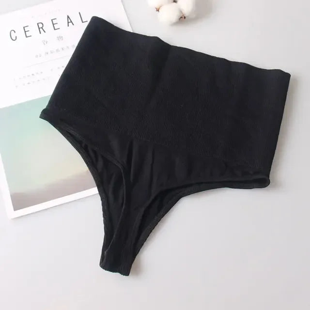 Black high-waist tummy control butt lifter thong shaper underwear laid on a white surface.