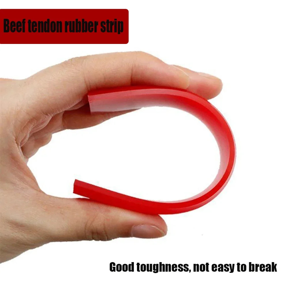 A hand is holding a red rubber strip, which is a beef tendon rubber strip.