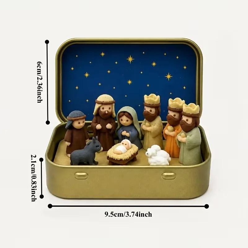A classic nativity scene featuring figures of Mary Joseph and baby Jesus in a gold-colored metal tin box with a blue starry b