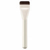 A professional flat foundation brush with soft bristles shown vertically.