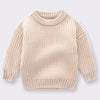 A beige knitted long-sleeve pullover sweater for kids.