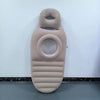 A beige inflatable maternity support pillow and yoga cushion hanging on a white wall.