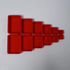 A row of nested, rectangular red surprise boxes made from 3D-printed material.