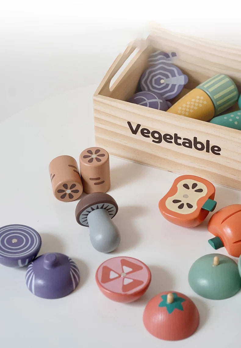 A wooden pretend play food cutting set with various vegetable shapes and a wooden box.