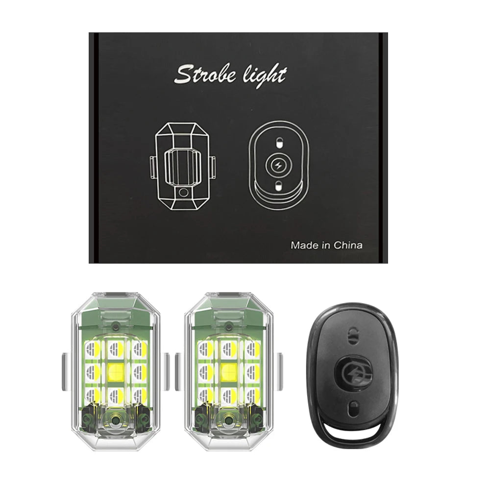 A black box containing strobe light components, including two LED light modules and a remote control.