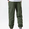 Men's olive green cargo joggers with pockets and white Adidas sneakers