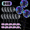 A collection of glowing LED light-up balloons in various colors and patterns against a black background.