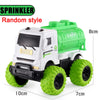 A white and green pull-back sprinkler toy SUV car with large tires and a green body.