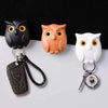 Ensemble de crochets mignons en forme de hibou noirs et blancs, avec des yeux clignotants.