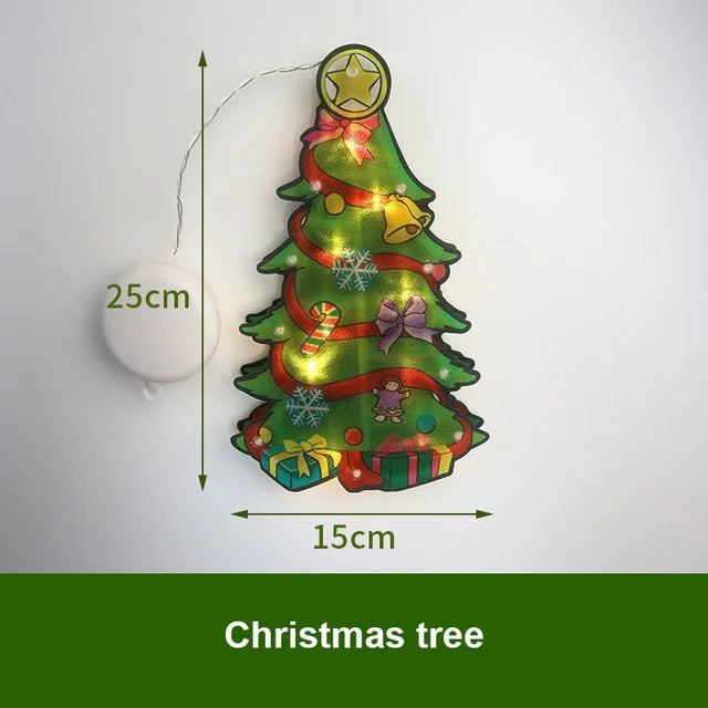 A festive Christmas tree decoration made of green lights and ribbon, suspended by a thin wire.