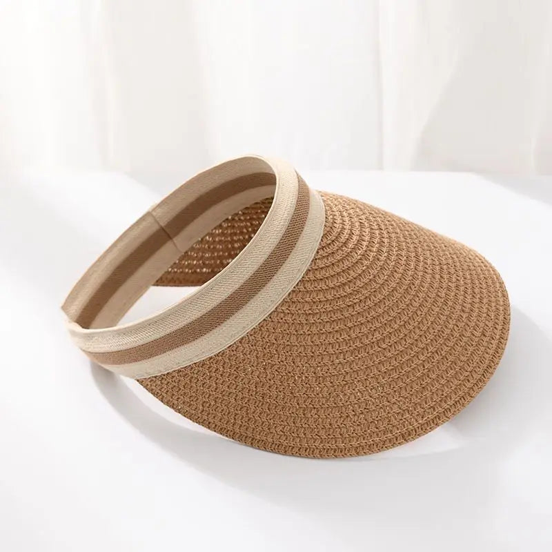 A woven straw sun hat with a wide brim in natural brown and beige tones.