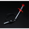 A red flexible drain snake with a metal shaft and black hose coiled on a dark surface.