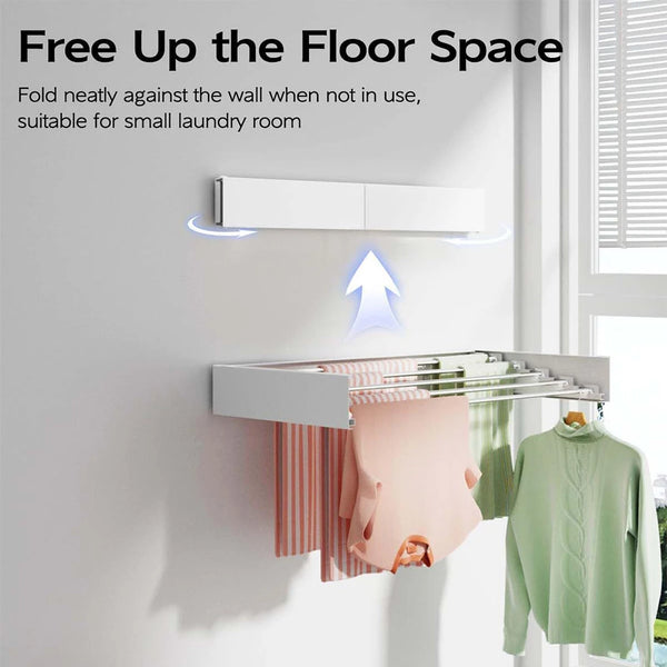 A white wall-mounted retractable clothes drying rack is shown mounted on a white wall, with clothes hanging from it.