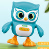 A blue owl toy with large eyes and an orange body is shown, labeled as a musical dancing toy.