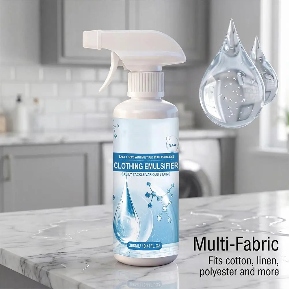 A bottle of Multi-Fabric Clothing Emulsifier spray with a white pump dispenser sitting on a marble countertop.