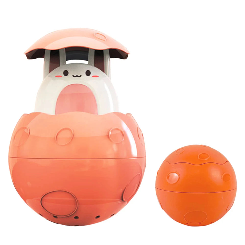 An orange bath toy shaped like a duck and penguin, featuring a water spray function.