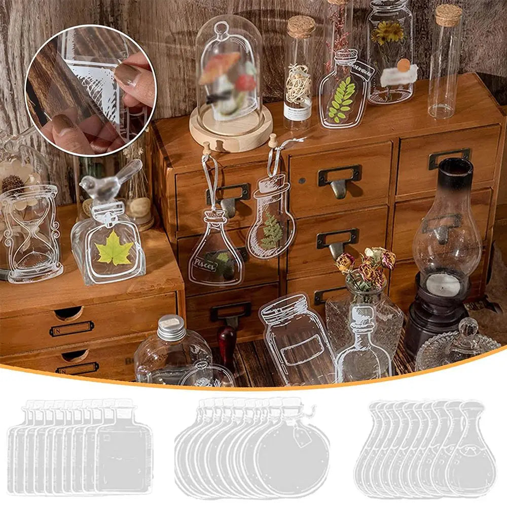 A set of thirty DIY transparent glass bookmarks featuring dried flowers and natural elements displayed on a wooden box.