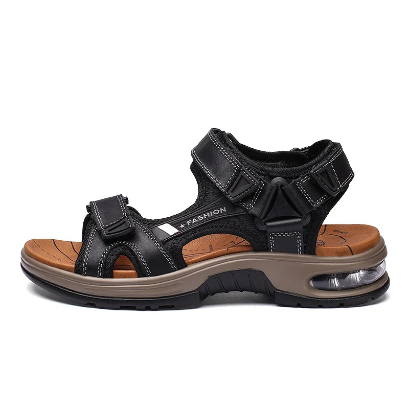A pair of black men's genuine leather air cushion sandals with a tan sole and strap details.