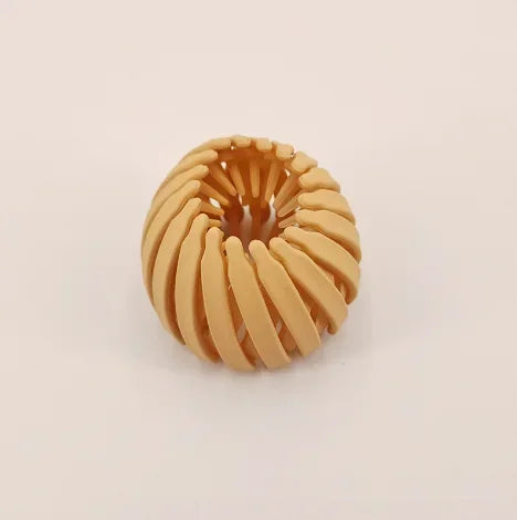 مشبك شعر على شكل عش طائر حلزوني باللون الذهبي