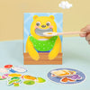 A yellow wooden bear toy is shown feeding food to a spoon, with various food cutouts scattered nearby.