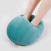 A teal fleece cover for a cozy USB heated foot warmer, shown on a person's foot.