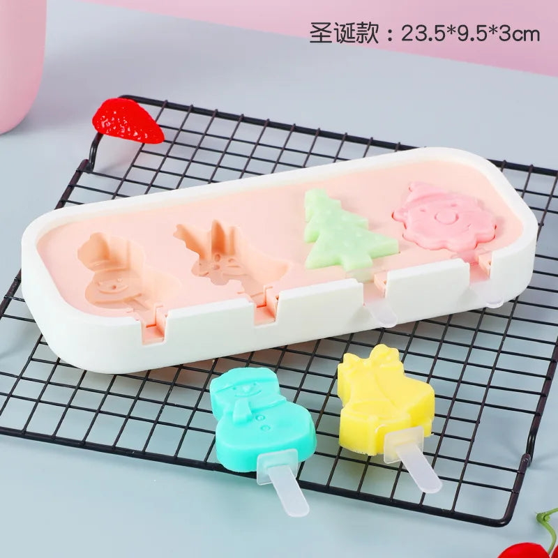 A silicone popsicle mold set featuring pink, green, and yellow fruit shapes on a black wire rack.