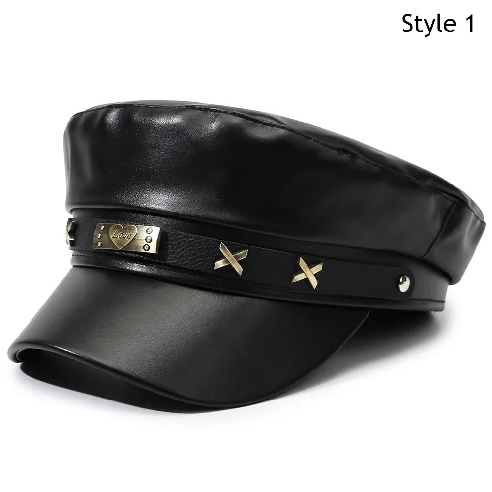 Black PU leather beret hat with a gold heart logo and decorative brass accents.