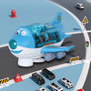 A blue electric airplane toy with lights and music flying over a gray road with traffic cones and emergency vehicles.