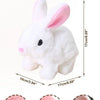 White plush bunny toy with pink ears, soft round eyes, furry tail, and floppy ears.
