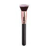 A professional makeup brush with a pink ferrule and black handle for foundation, concealer, and blush application.