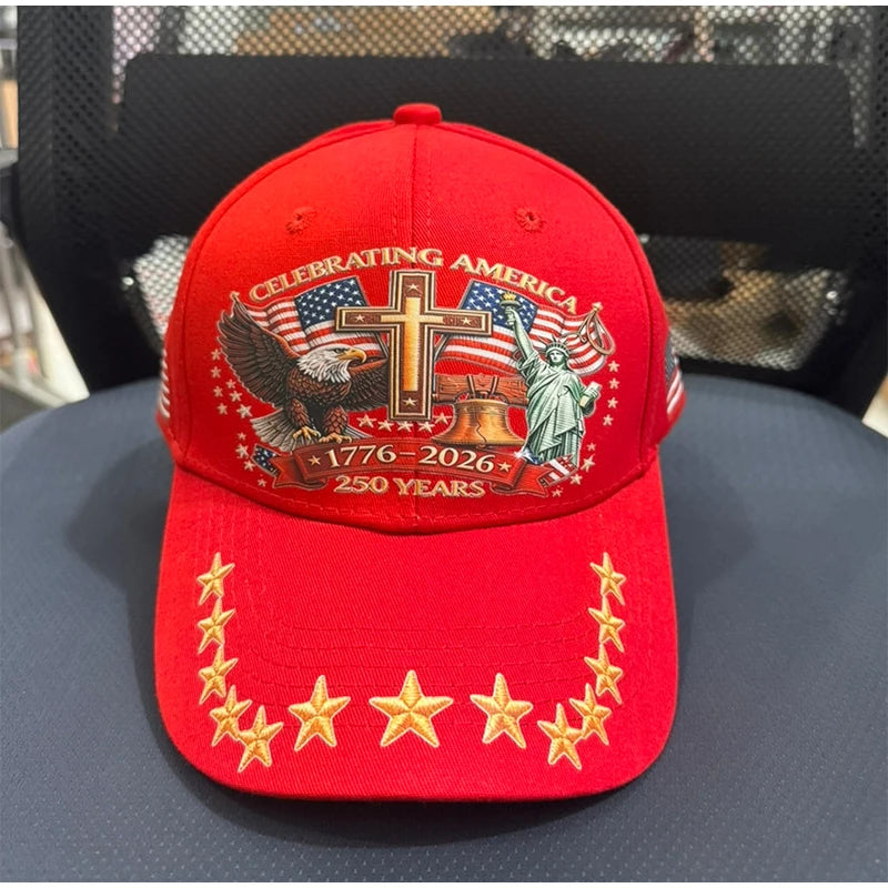 Red baseball cap featuring a patriotic graphic design with an eagle and a statue of liberty.