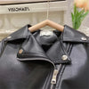 A black faux leather zipper jacket displayed on a hanger against a white background.