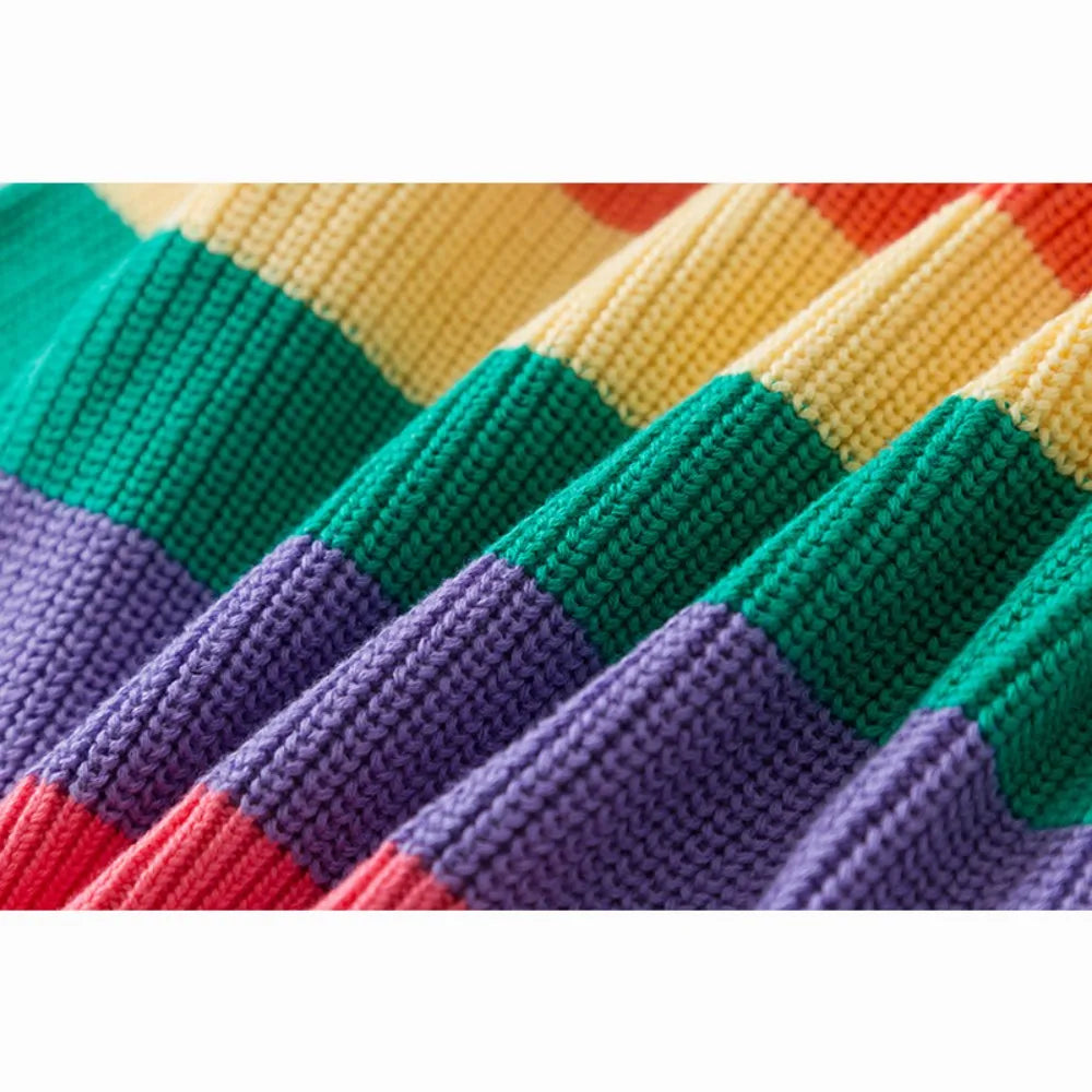 Close-up of a girls' rainbow striped knit sweater showing various colors like green, yellow, purple, and red.