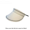 A white wide brim sun visor hat is shown from a slight angle against a white background.