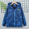 A blue waterproof hooded jacket with a geometric pattern and a zipper displayed on a hanger.