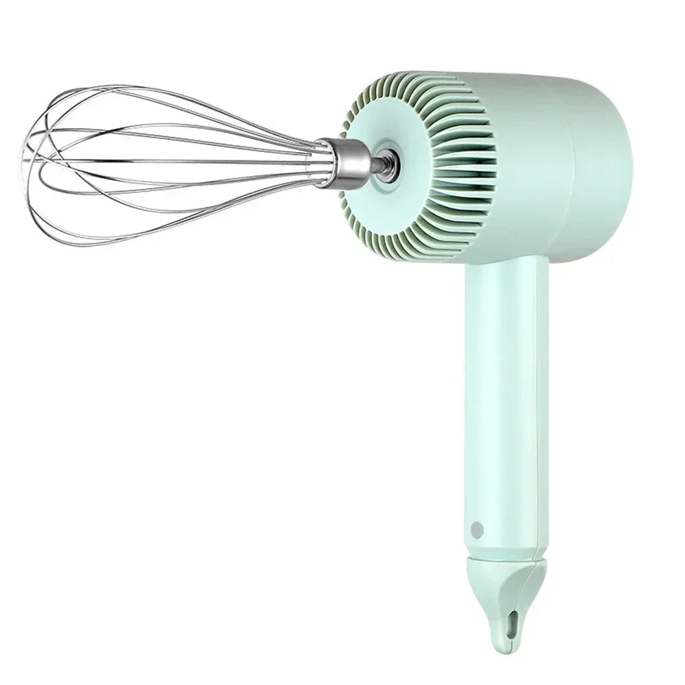 A light mint green electric hand mixer set with a whisk attachment and a blending head.
