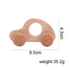 A light wood hand-pushed cart toy for toddlers with a rounded shape and a hole.