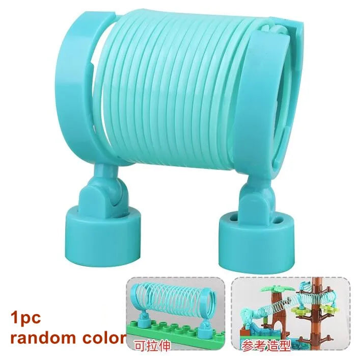 A teal marble run building blocks set with tracks and funnels shown in a coiled cylindrical shape.