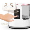 A hand is operating a white electric makeup brush cleaner with a touch screen display showing 2H or 5H timed air drying funct