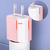 A pink and white silicone charger protector and cable organizer with metal tips, shown next to a coiled white cable.