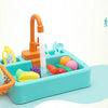 A children's pretend play kitchen sink set with running water, featuring various colorful food items and utensils.