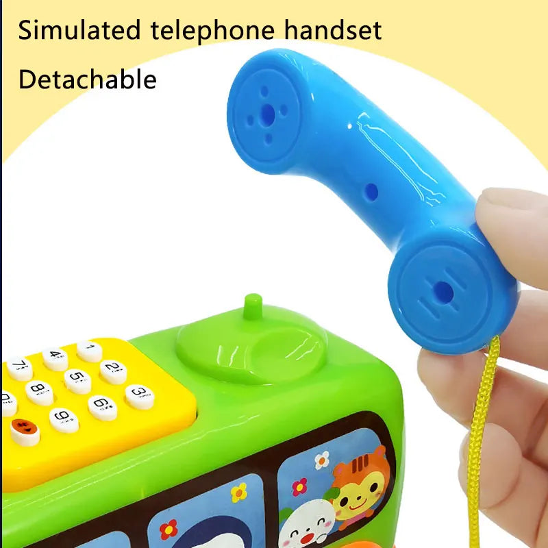 A blue detachable simulated telephone handset is shown connected to a green toy phone for toddlers.